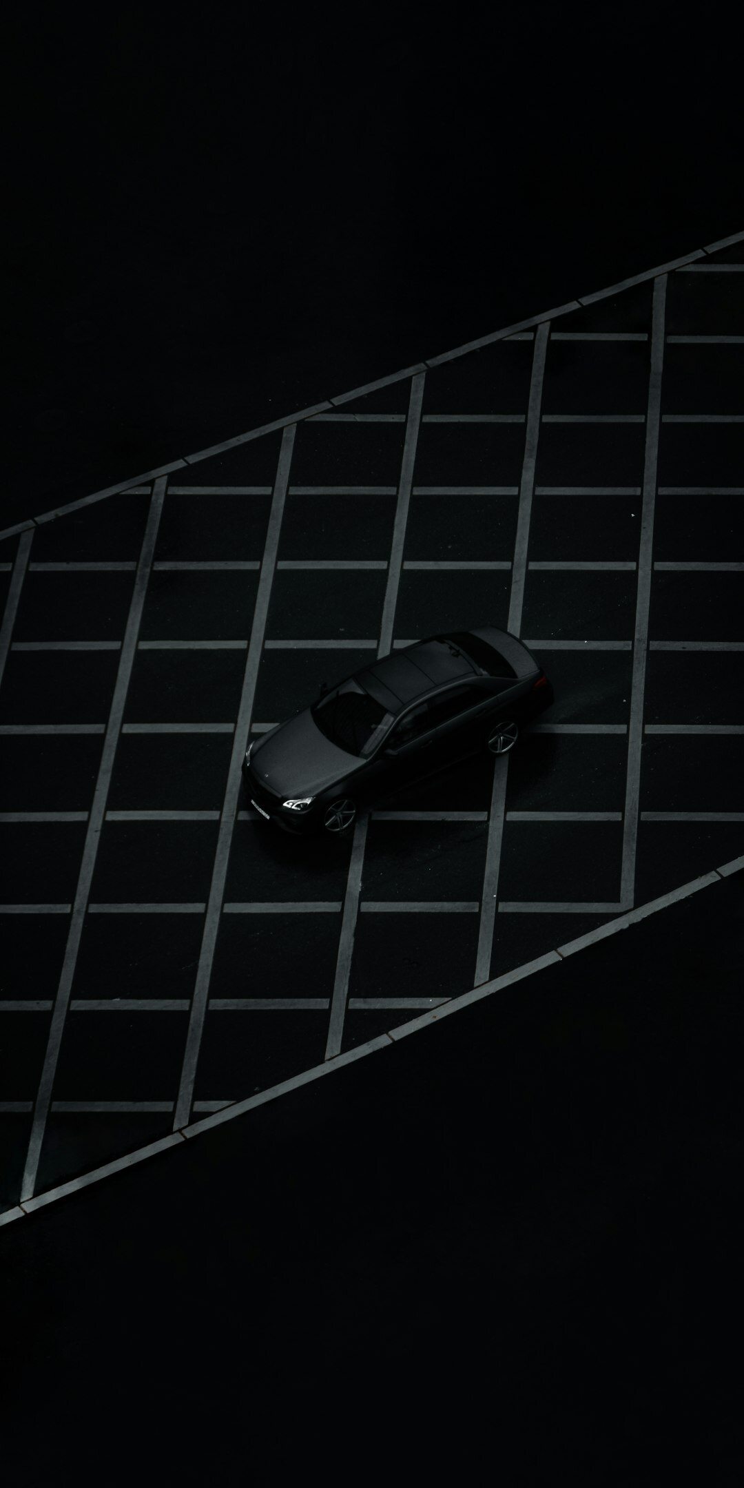 Futuristic hypercar in a dark photography studio with dramatic rim lighting