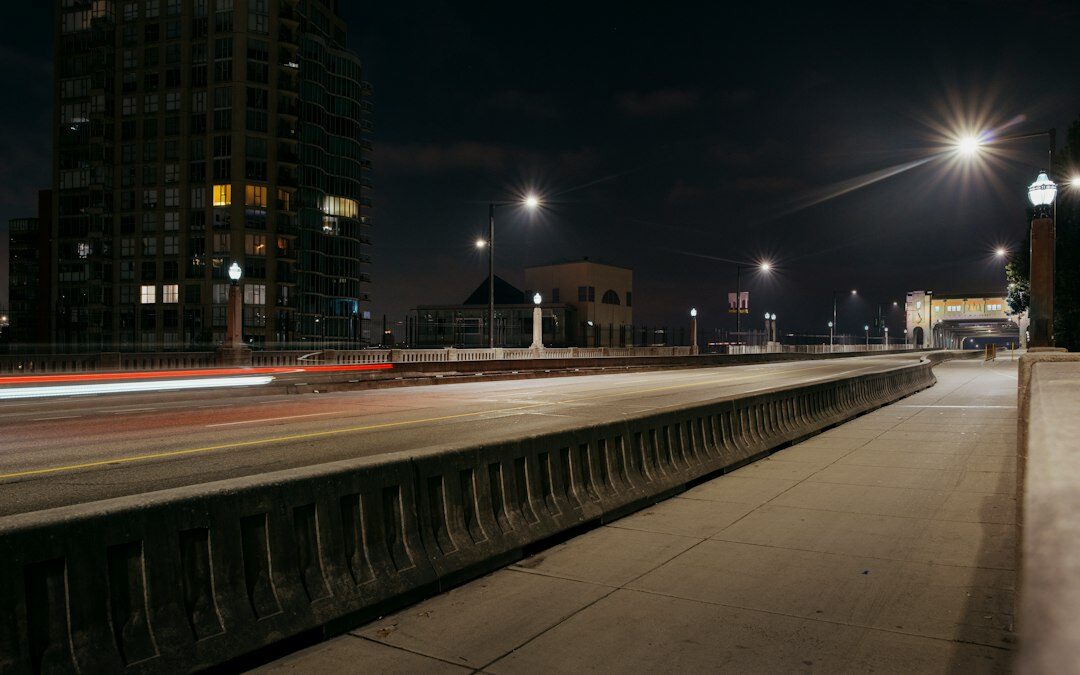 Modern hypercar driving on an empty road at night with light trails