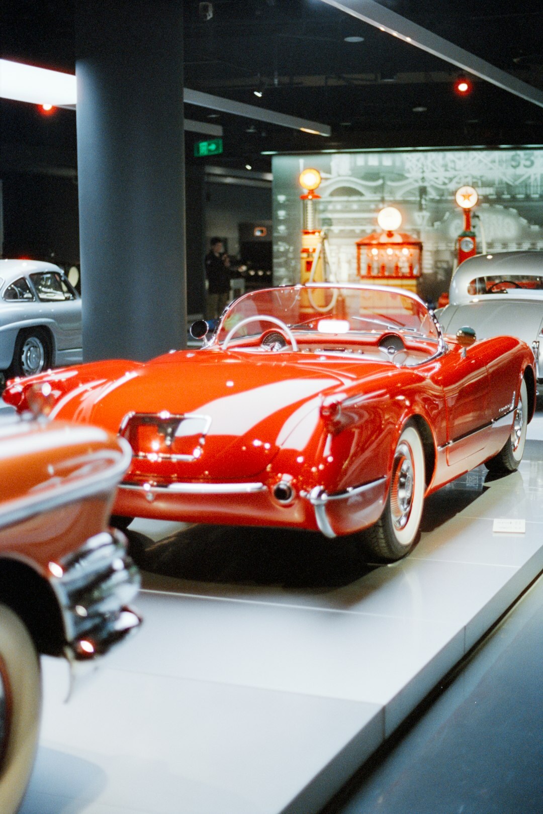 Interior of a classic car museum with vintage automobiles on display
